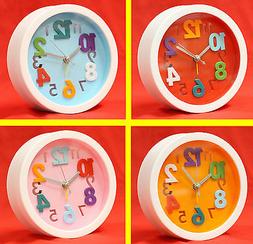 TRAVEL ANALOG DESK ALARM CLOCK 4 COLOR ROUND AA BATTERY OPER
